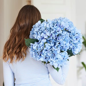 Woman with blue flowers