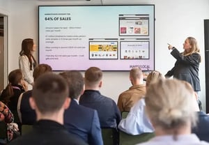 employees giving a presentation to a crowd