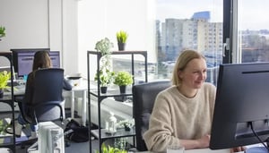 Employees at Vilnius office working on the computer