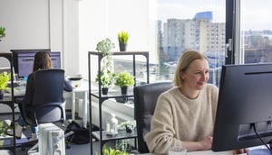 Employees working on computers at Vilnius office