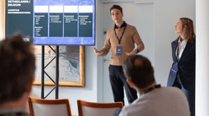 Speaker_presenting_and people_listening-1